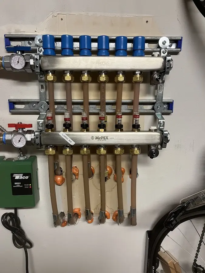 Plumber performing Water Heater Repair at a residential property in Roselle